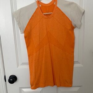 Oiselle Vibrant Orange and Cream Short Sleeve Top